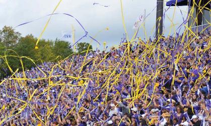 Football fans fly their purple and gold streamers Football fans fly their purple and gold streamers