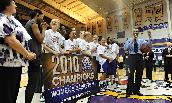 The JMU Women's Basketball team celebrates a CAA Championship.