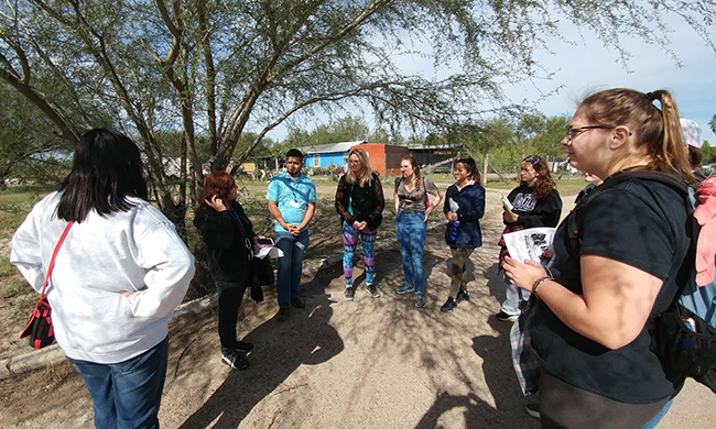 Group of students and faculty at US-Mexico border