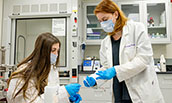 Nancy Mack and Kristin Ponder working in lab