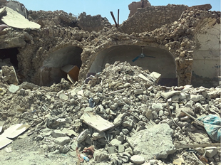 Figure 6. Disarticulated remains and camouflaged patterned clothing in the rubble in west Mosul demonstrates the need for careful operational planning (2017).  Figure courtesy of Gareth Collett. 