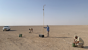 Image 6. NPA field staff helping to set up the baseline TIR field test site in the desert.