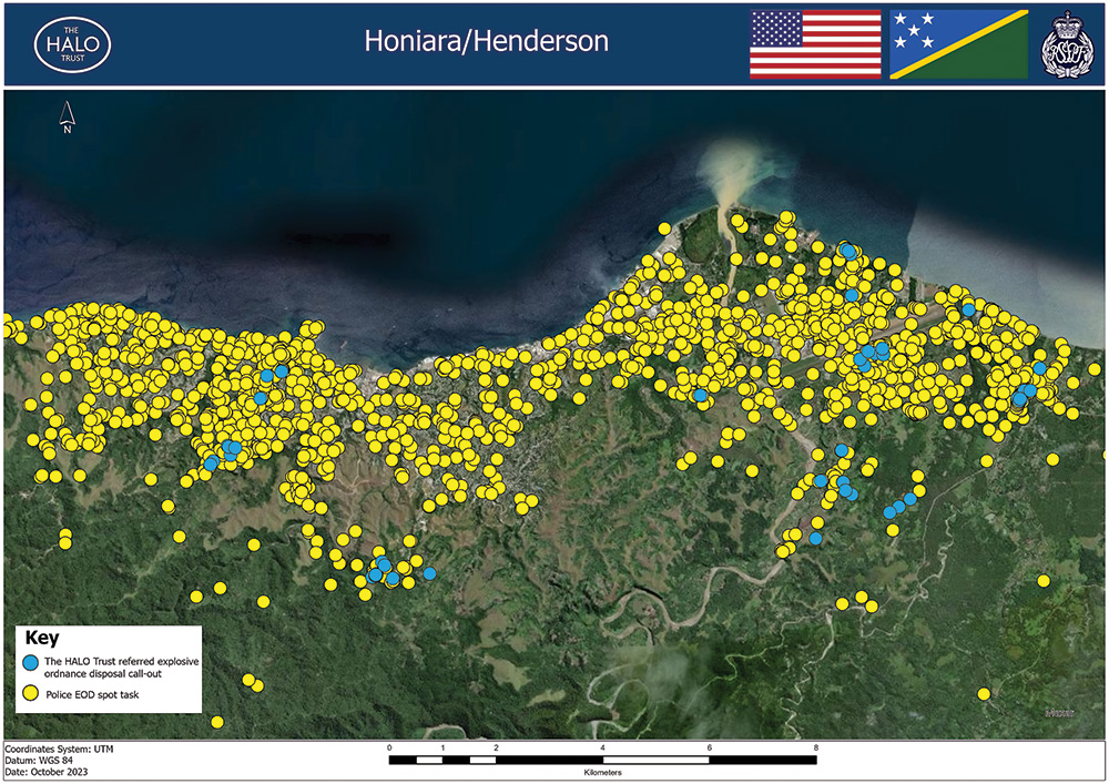 Green topographic map with hundreds of tiny yellow and blue circles indicating explosive ordnance disposal work in the Honiara and Henderson area of the Solomon Islands. 