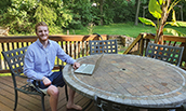 CIS major Wes Jamison in his deck 'office' while participating in a virtual internship - 2020