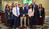JMU Banking Team members and advisor Carl Larsson (2nd from r) with members of F&M Bank