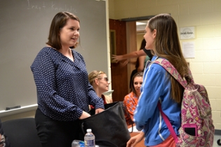 Alumni speaking with a student at the 2016 Alumni Career Panel