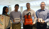 Four student winners of the Silverback Strategies AdWords challenge with their prizes