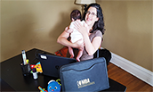 MBA Student Heather Joffe-Reyes, studying at home with son