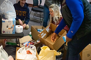 Students sorting donated items during MLK Day of Service - 2019