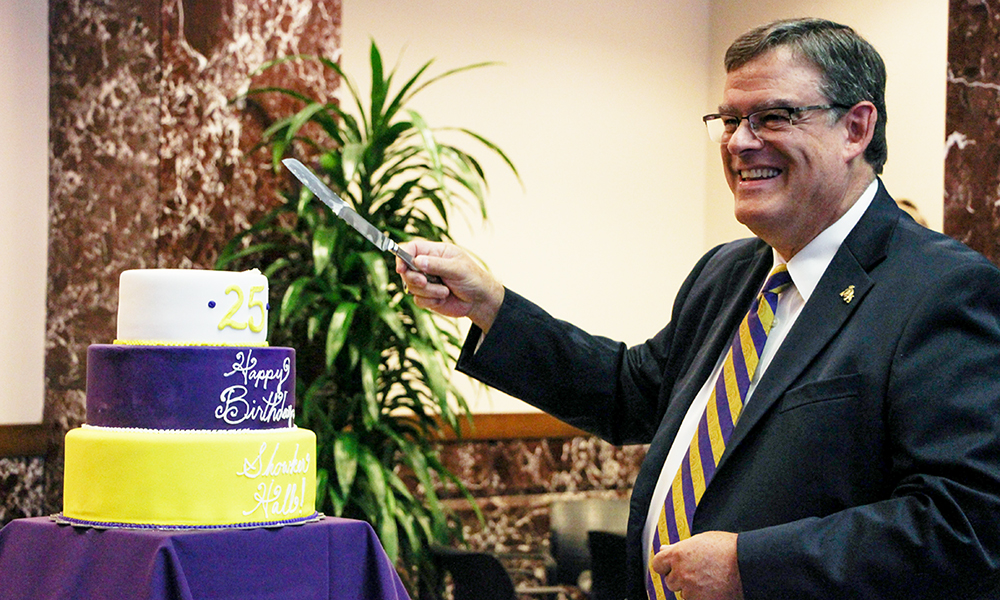 Joe Showker cutting the cake at the Zane Showker Hall 25th birthday - 2016