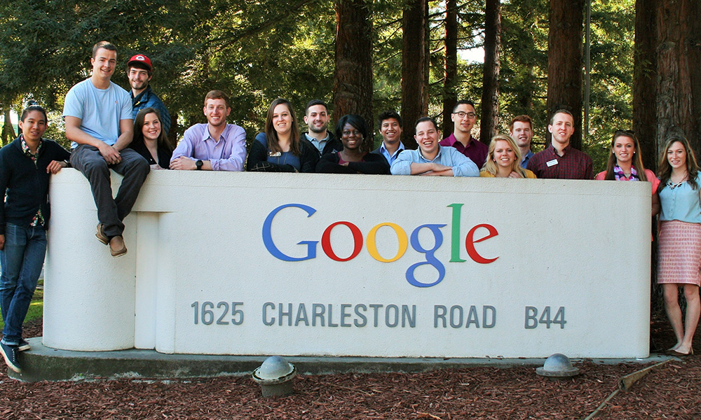 Group of JMU students posed on and around the Google headquarters sign