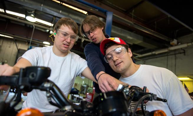 Chris Bachman teaching students in Alternative Fuels Lab.