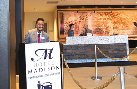 HM Student greets visitors at the Hotel Madison