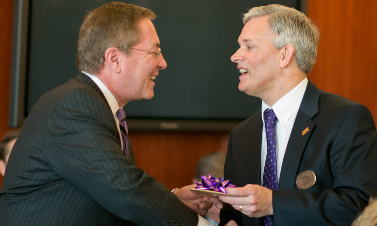 Greater Madison President Jim Sipe Jr. presented President Alger, an avid coin collector, with a set consisting of a James Madison $1 Presidential Coin, and a Bronze Medal bearing the likeness of Dolley Madison.