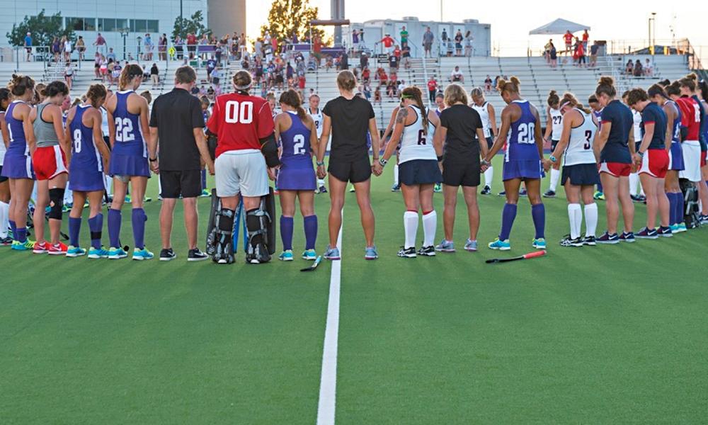 Field hockey team gathers before a game