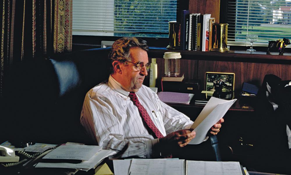 Image of Carrier at his office desk
