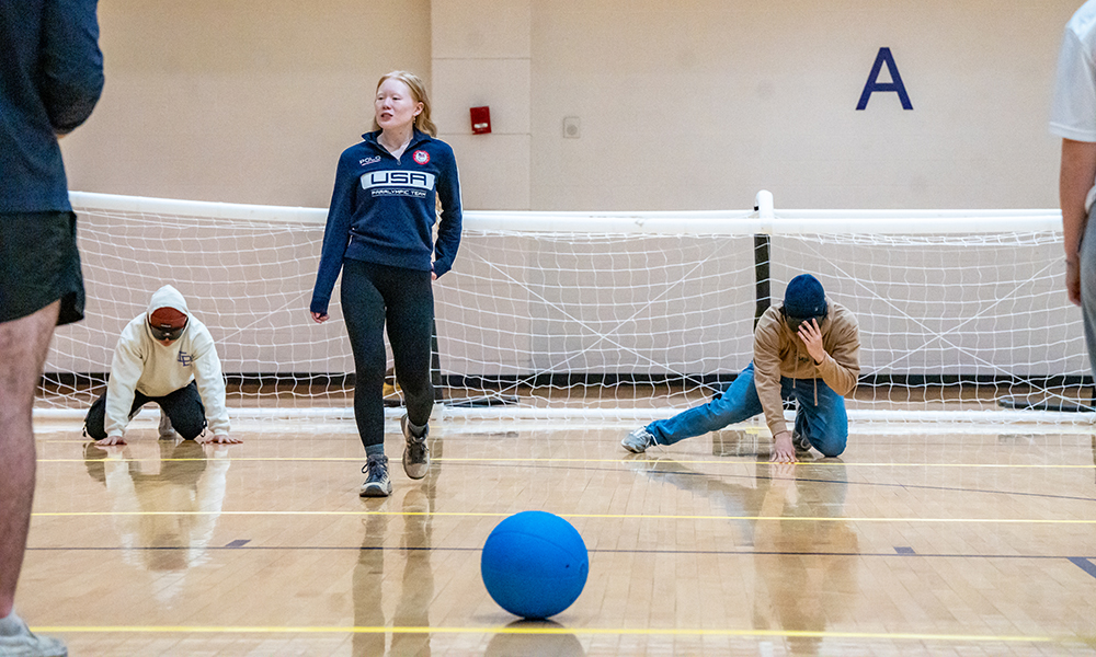 Students learn goalball from a Paralympic athlete at the Paralympic Skill Lab coaching workshop at UREC.