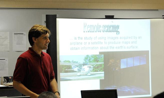 Photo of professor Zack Bortolot conducting CyberCity program