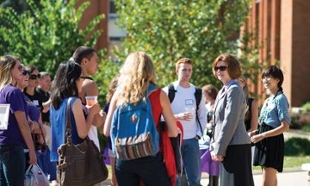 College of Business Dean Mary Gowan talks to students on JMU campus