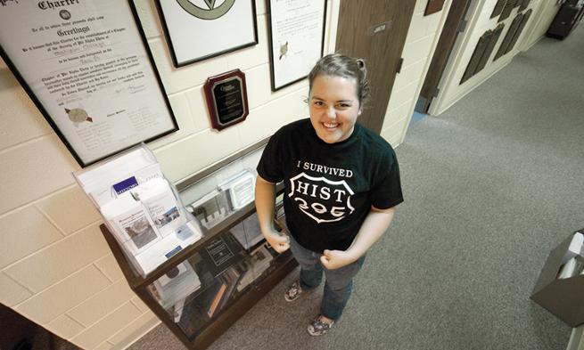 Jessica Harvey ('11) proudly displays her I Survived HIST 395 T-shirt.