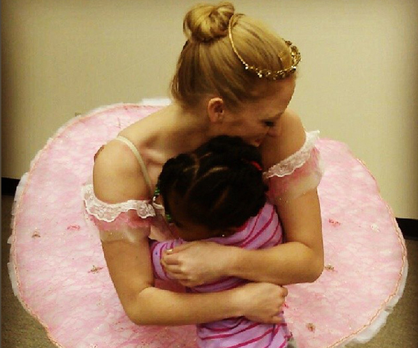 Caitlin McAvoy in her role as Sugar Plum Fairy gets an appreciative hug from a fan
