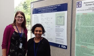 Carly Starke poses with Dr. Madushini Dharmasena at NIH poster session