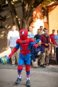 This little Spiderman is enjoying his early Halloween on Greek Row.