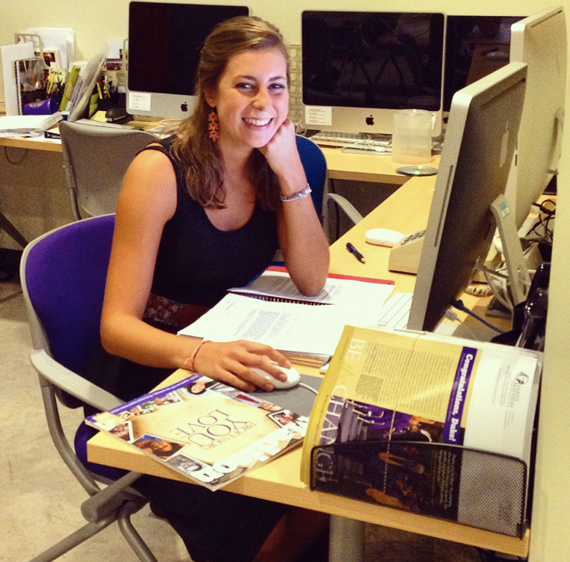 Photo of Emily Tait at a desk during her internship.