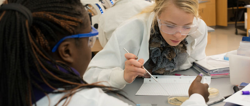 Female biotech students in research lab