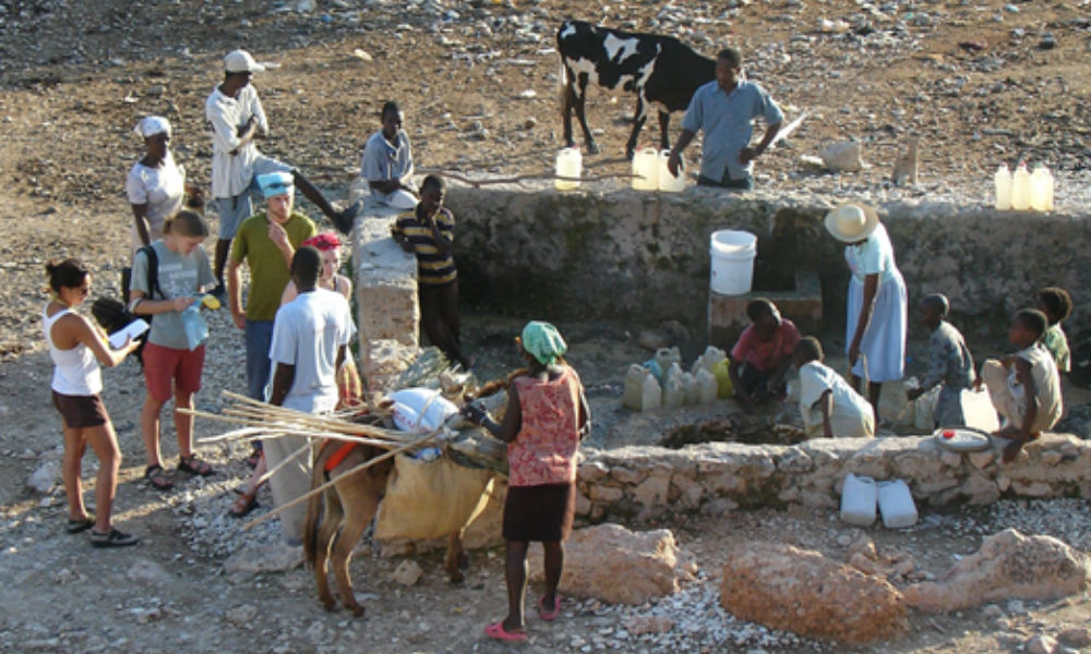 JMU students at well in Mahotierre