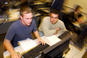 Photo: Students collaborate in a computer lab