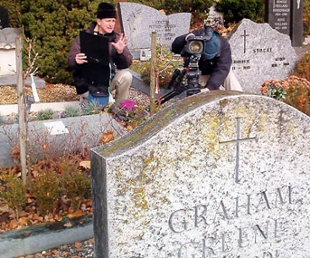 Photo of filmmaker Tom O'Connor with videographer setting up a shot in a cemetary