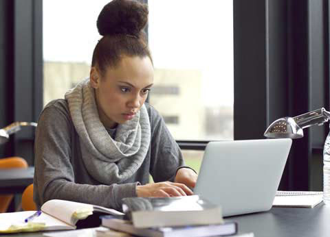 photo of woman at computer