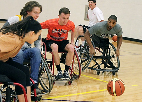photo of students playing Adaptive basketball