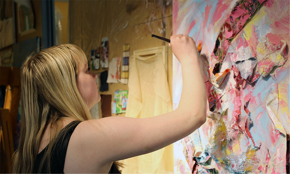 Student paints in the painting studio