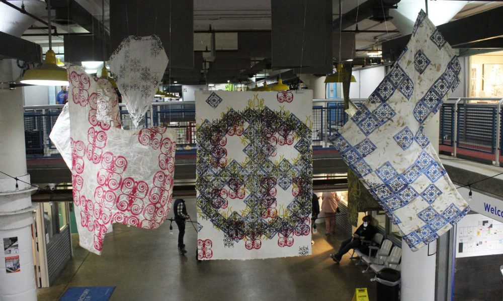 Installation of hanging fabrics with stamped patterns
