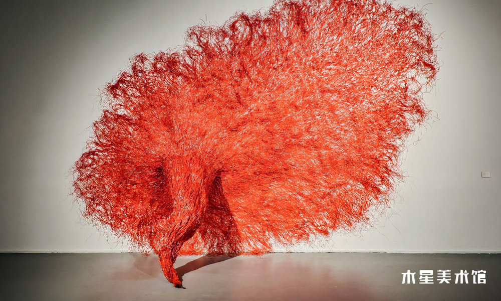 MiKyoung's "Symbiosis." Red constructed textile piece