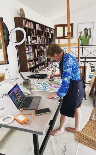 Tubach paints in her studio.