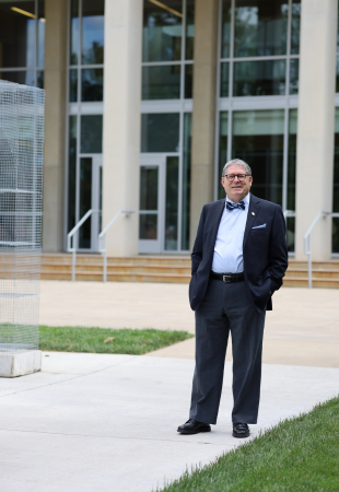 Dr. Cole Welter in front of Duke Hall