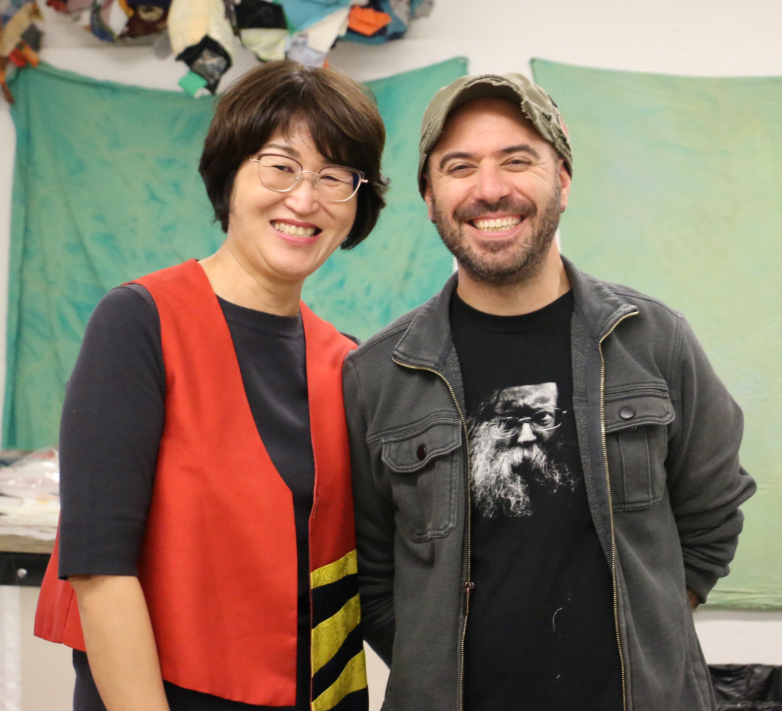 Rob Mertens poses with one of the hanbok masters.