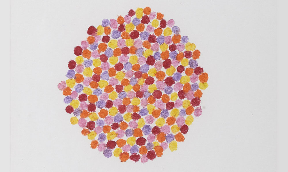 A circle composed of yellow, purple, pink, red, and orange dots.