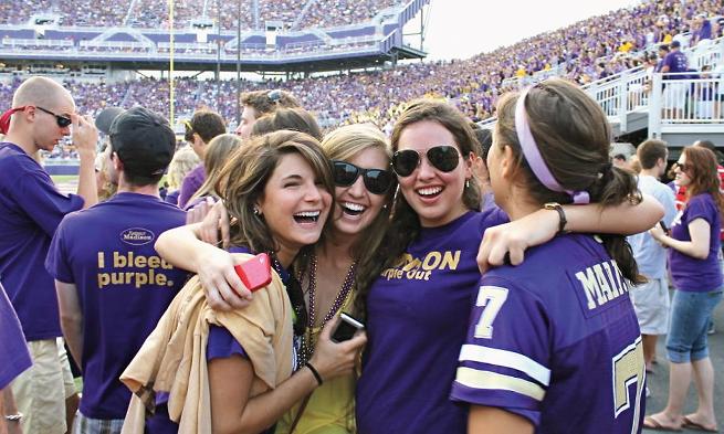 Alex LaMar ('12) celebrates a home football game with classmates