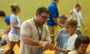 Professor Tom Moran working with children