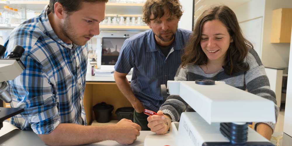 Students with Mark Gabriele in Biology lab