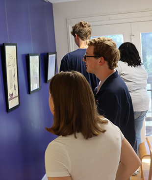 Visitors enjoying FFPC's Broadside Gallery during the opening exhibit. Photo by Megan Nicole Medeiros, FFPC.