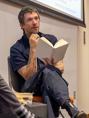 Best-selling author Jesse Ball reads from his novel Silence Once Begun. Photo by Abby Anderson, JMU Libraries.