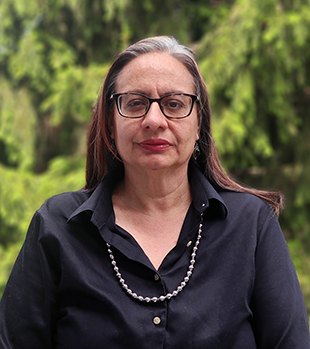 Fawn-Amber Montoya, a woman with medium-length brown hair wearing a black shirt.