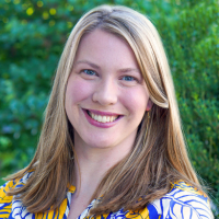 headshot photo of Claire Denny who is a female with medium length strawberry blonde hair. 