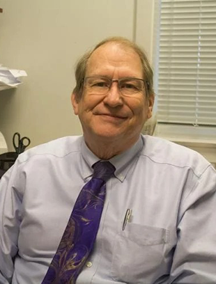 A portrait of George Johnson in his former JMU office.