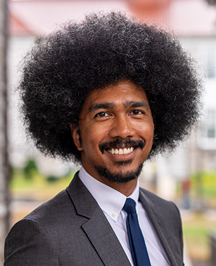 A young man wearing a suit and tie.